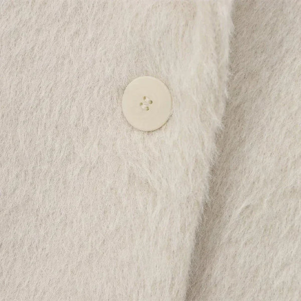 White mohair blazer showing regular fit and comfortable movement for busy days