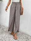 Floral wide-leg chiffon pants for women, ankle-length, elastic waist, perfect for summer fashion and casual chic outfits.