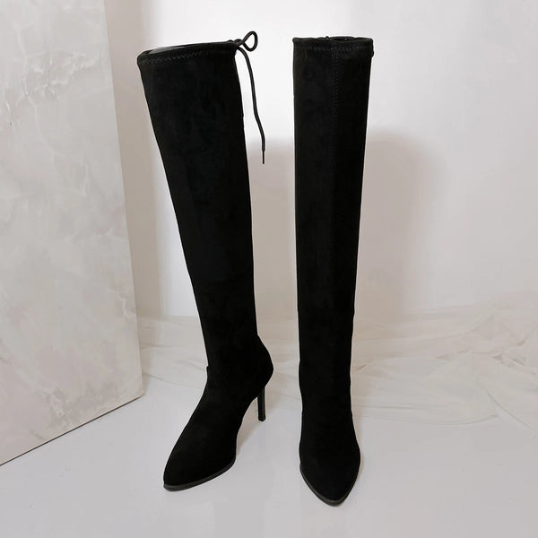 Sophisticated over-the-knee boots in soft suede with romantic lace-up detail and stiletto heels
