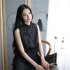 Versatile linen top transitioning from casual to evening wear.