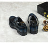 Stylish black leather Oxfords with a modern lace-up design.