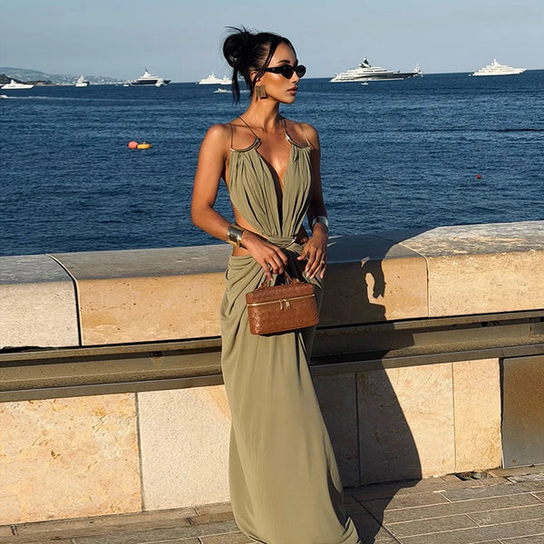 Backless evening gown with halter neckline and contemporary waist cutout styling