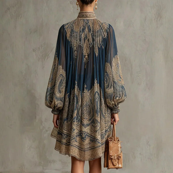 Loose fit bohemian dress with artisanal embroidery and asymmetric hem detail