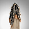 Stylish dual-tone wraparound shawl for women, perfect for travel.
