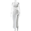 Ankle-length dress featuring unique neckline and flirty split detail