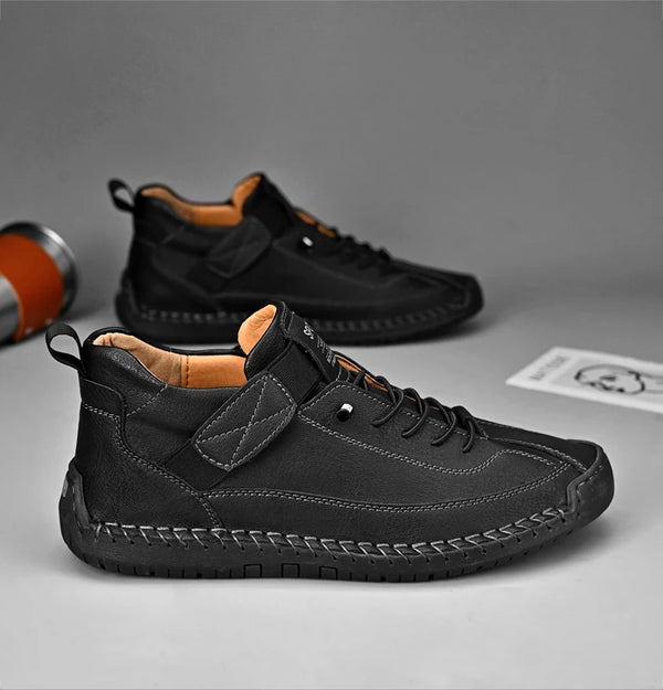 Rear view of handcrafted leather loafers showing expert heel construction and weather-ready rubber outsole