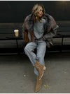 Detail of smooth-glide zipper on oversized plush hooded jacket