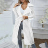 Lightweight belted trench coat draped over sundress for breezy summer evenings