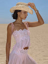 Close-up of exquisite lace craftsmanship on elegant formal top