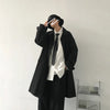 Chic Japanese vintage trench coat for men in black, featuring a single-breasted closure and stylish turn-down collar.