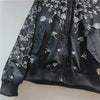 Pocket detail on sequin jacket combining functionality with decorative embellishments