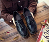 Black tassel loafers that transition effortlessly from day to night.