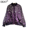 Close-up of hand-applied sequin embellishments and embroidered details on jacket fabric