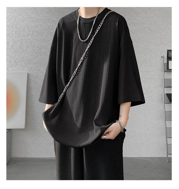 Close-up of short sleeves on striped summer tee, designed for warm weather comfort.