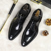 Elegant black leather Oxfords ideal for formal and business settings.