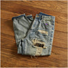 Side view of Rebel Spirit Distressed Jeans highlighting the durable denim fabric.