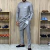 Side view of African heritage two-piece showing patchwork detail and relaxed fit silhouette