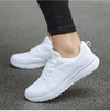 Women's white mesh athletic sneakers with vibrant multi-color trim
