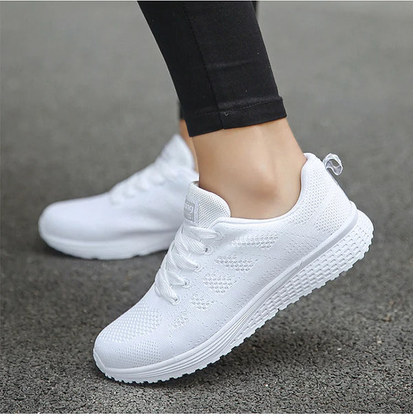 Women's white mesh athletic sneakers with vibrant multi-color trim