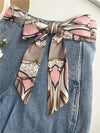 Chic fabric belt for women with geometric design, versatile for dresses, jeans, or as a scarf and headband accessory.