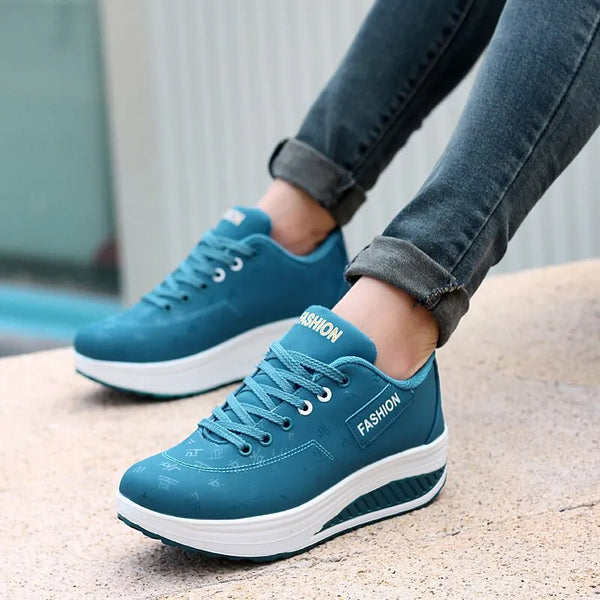 Stride Higher Chunky Platform Wedge Sneakers in white with lace-up closure