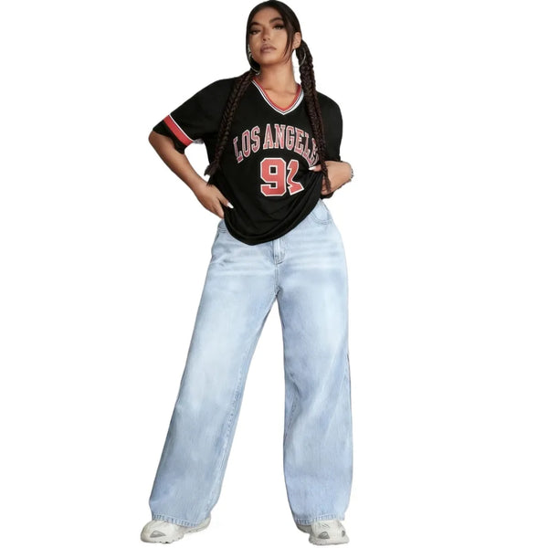 High-waisted light wash denim jeans for cozy confidence in winter.