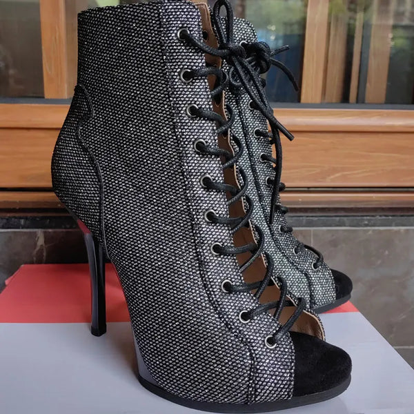 Women's statement ankle boots featuring glamorous snake design