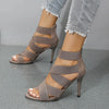 Sophisticated black stiletto sandals with a durable rubber outsole.
