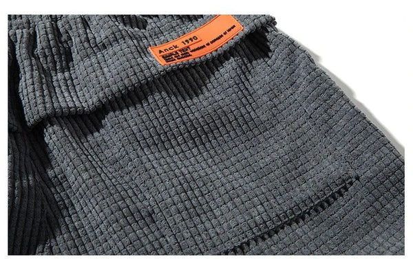 Flat lay of thermal corduroy joggers displaying full length and ribbed texture