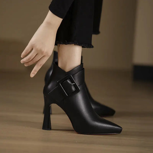 Pointed leather pumps with buckle detail styled for office to evening wear
