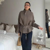 Autumn jacket featuring sleek zipper closure and defining waist belt for flattering silhouette