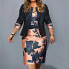Floral sheath dress in autumn hues, knee-length, perfect for office wear.