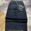Embroidered denim jeans with artistic flair for self-expression.