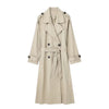 Versatile double-breasted trench coat paired with denim for casual chic look