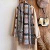 Lightweight yet warm scarf in a vibrant pattern, perfect for chilly evenings.