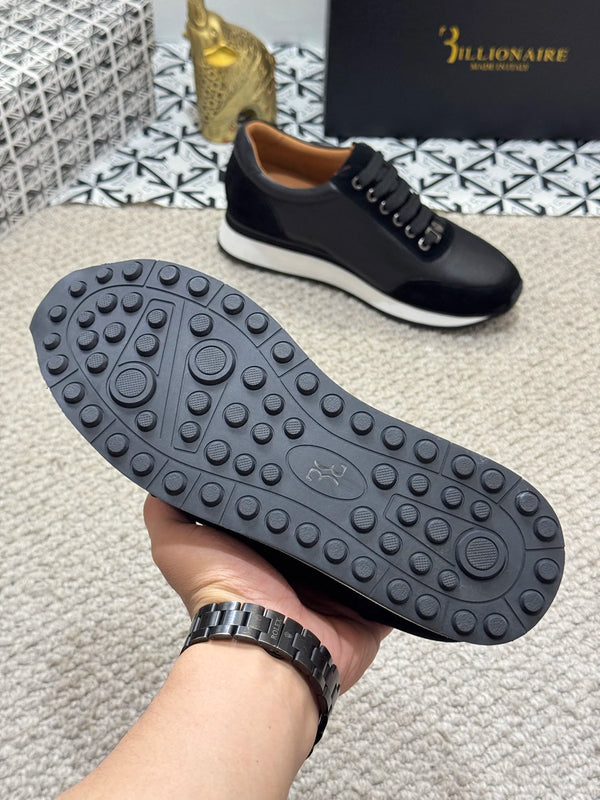Close-up of slip-on design of Billionaire black loafers.