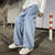 Premium cotton blend jeans in black with relaxed wide-leg silhouette for men