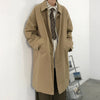 Chic Japanese vintage trench coat for men in black, featuring a single-breasted closure and stylish turn-down collar.