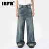 Washed blue wide leg denim jeans for men with relaxed fit and vintage style