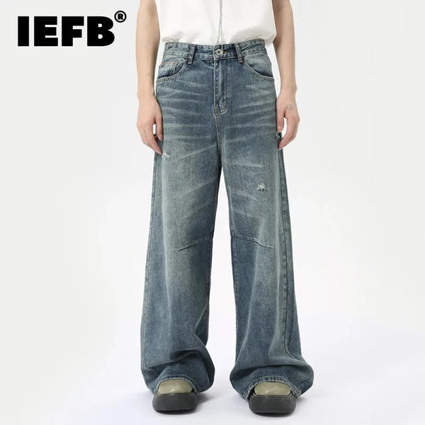 Washed blue wide leg denim jeans for men with relaxed fit and vintage style