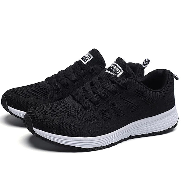 White sports footwear featuring mesh lining and vibrant color accents