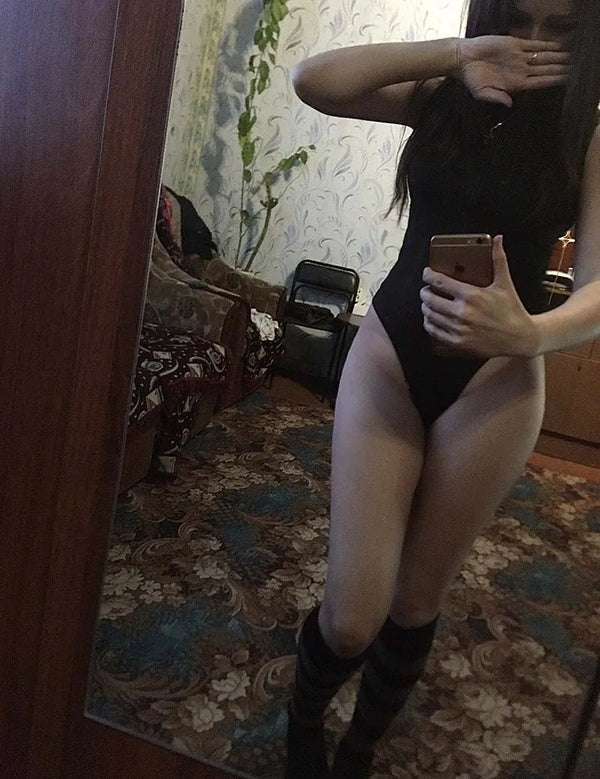 Black bodysuit with front zipper styled for date night