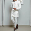 Complete two-piece African patchwork set laid flat showing shirt and pants pattern coordination