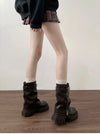 Chic women's mid-calf biker boots with buckle detail, cozy plush lining, and durable rubber sole for stylish comfort.