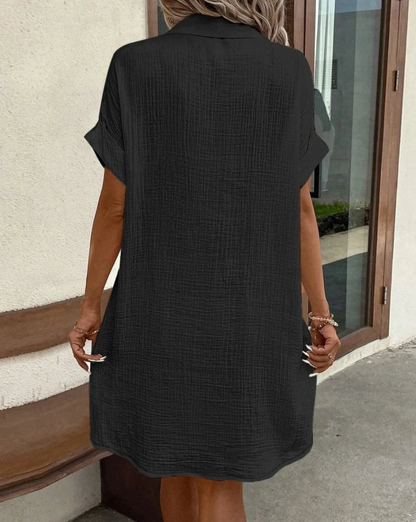 Cotton-linen blend mini dress featuring classic V-neck design and breezy summer fabric