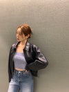 Chic cropped leather jacket for women in premium faux leather, perfect for autumn and winter streetwear fashion.