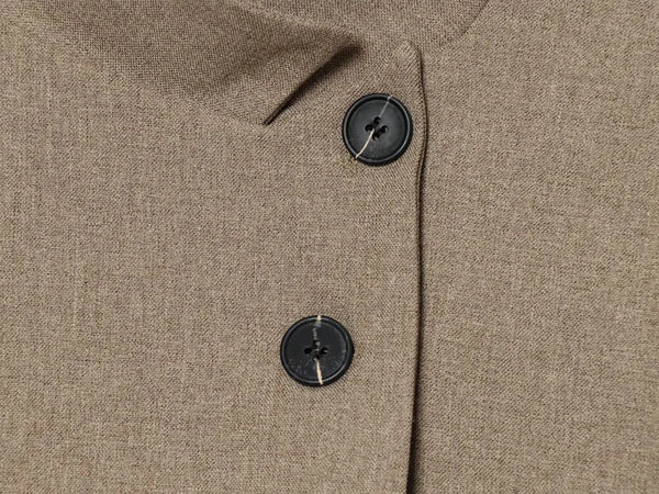 Classic single-breasted blazer featuring unique stand collar