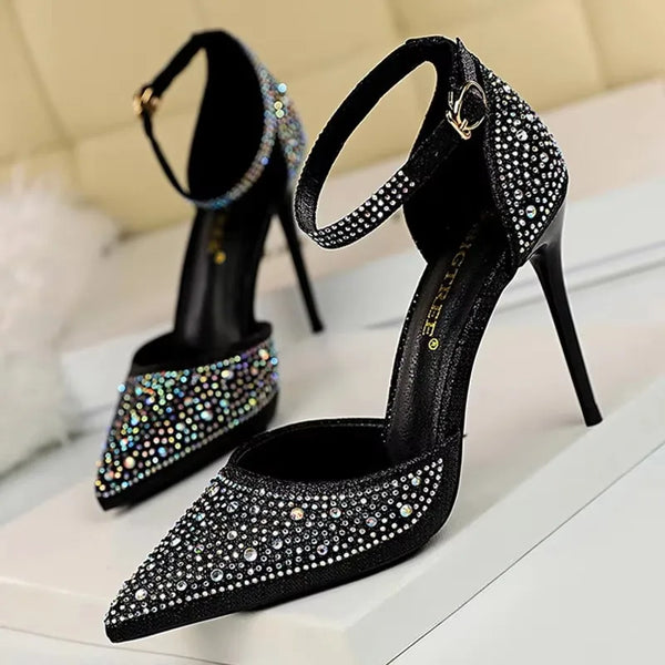 Close-up of light reflecting off rhinestone embellishments on stiletto pumps