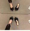 Beige pointed toe sandals with elegant bow accent and true-to-size fit