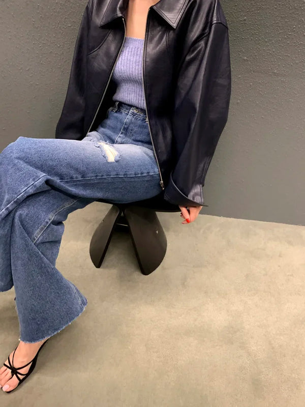 Chic cropped leather jacket for women in premium faux leather with stylish turn-down collar and secure zipper closure.